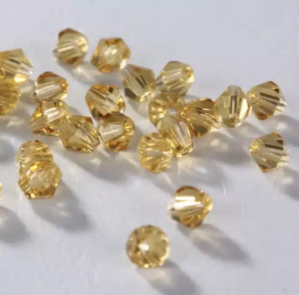 Karoliukai Bicone 4mm Amber (oranžinė)